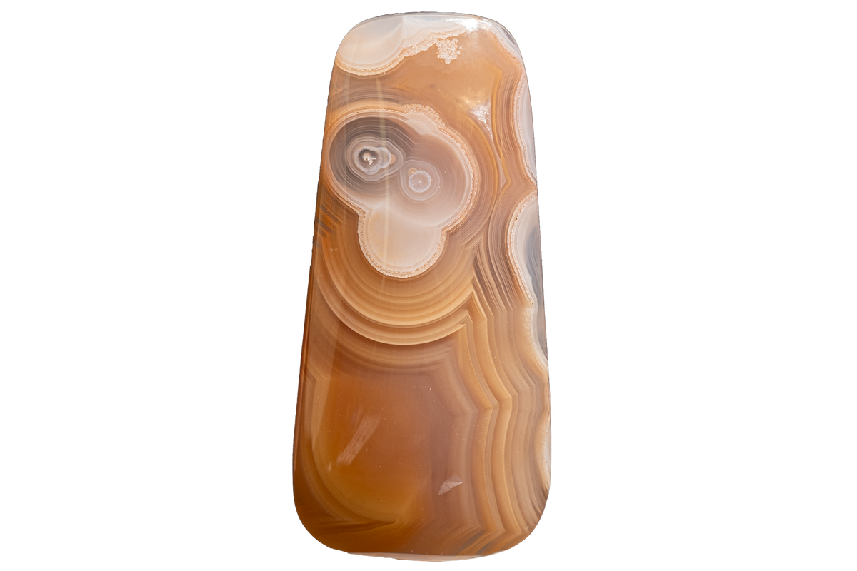 A polished agate stone pendant with concentric banding in shades of brown, tan, cream, and gray, isolated on a solid white background.
