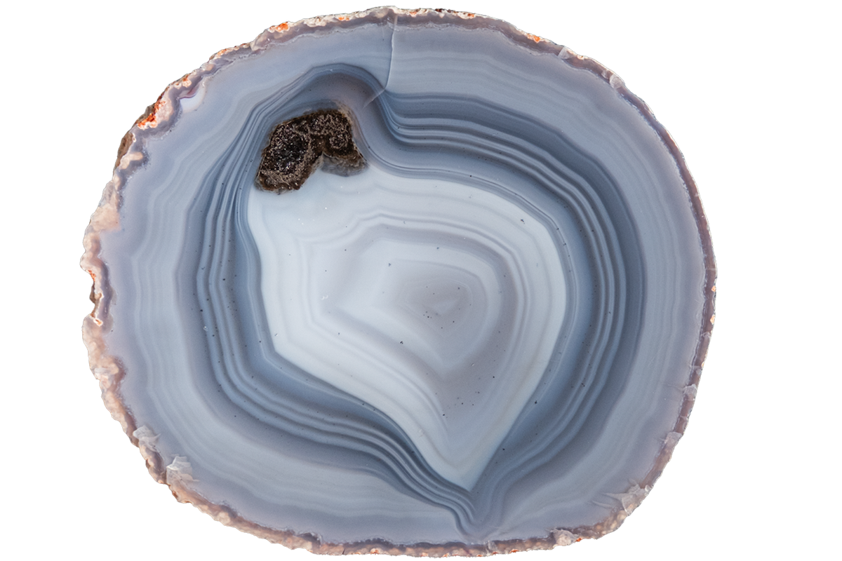 A polished slice of agate stone with concentric bands of light blue, gray, and white, featuring a natural rough edge and a small dark brown inclusions area near the upper left, isolated on a white background.
