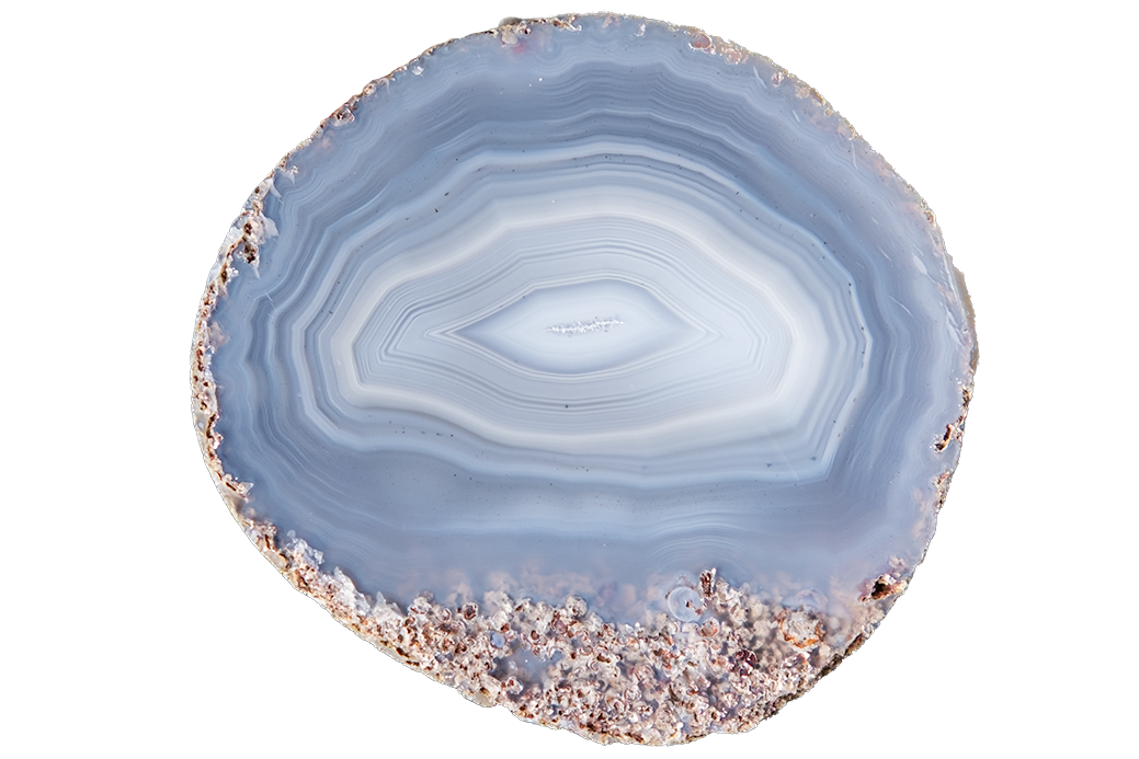 A polished slice of agate stone with concentric bands of light blue, white, and gray, featuring a textured, crystalline rose-gold outer rim, isolated on a solid white background.
